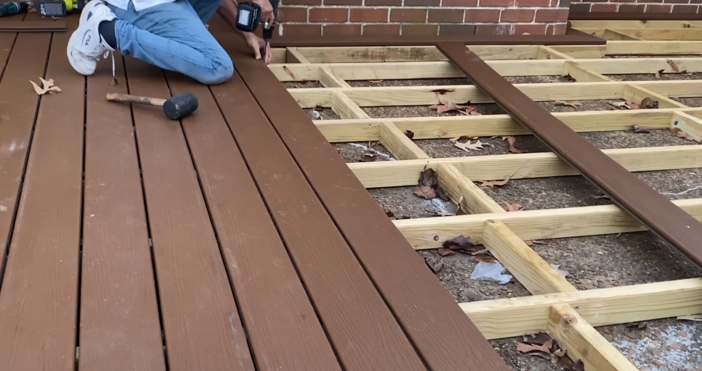 Modern composite decking materials with protective cap layer